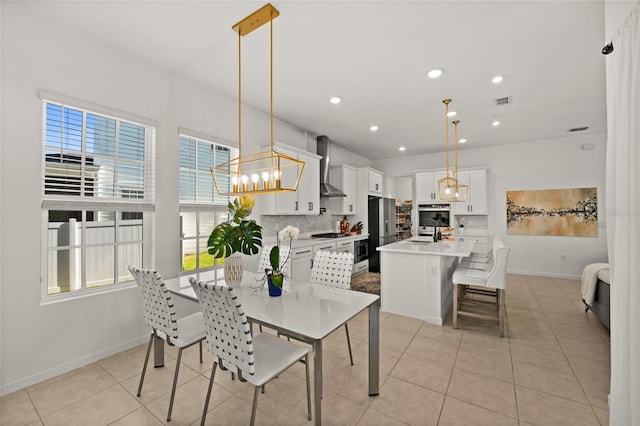 dining space with visible vents, baseboards, recessed lighting, a chandelier, and light tile patterned floors