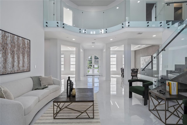 10849 Emerald Chase Dr, Orlando, FL 32836 - living room featuring a towering ceiling, recessed lighting, and stairs