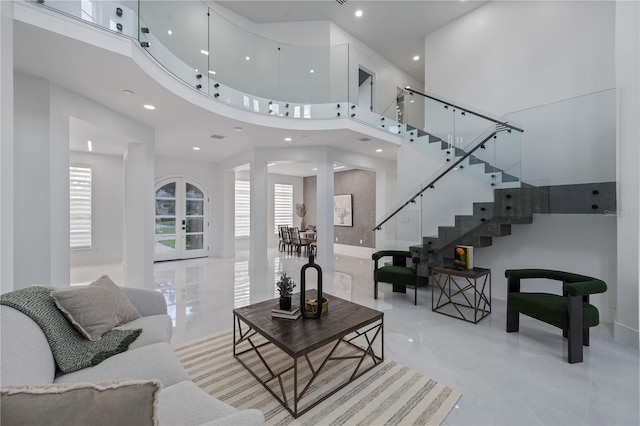10849 Emerald Chase Dr, Orlando, FL 32836 - living room featuring a towering ceiling, recessed lighting, and stairs