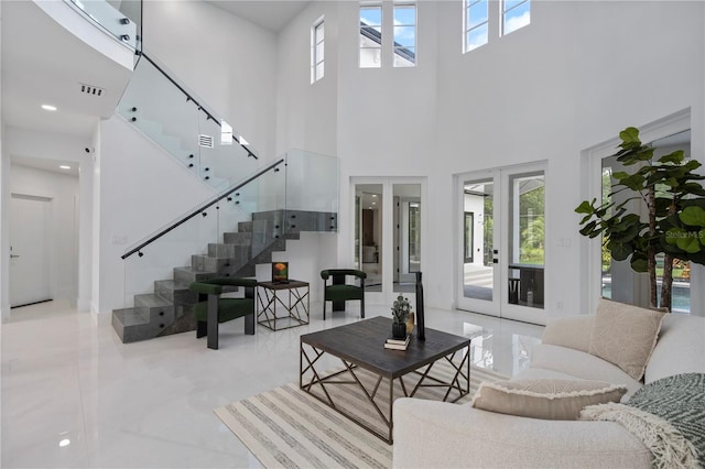 10849 Emerald Chase Dr, Orlando, FL 32836 - living room with stairs, a towering ceiling, and french doors