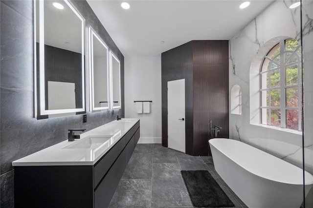 10849 Emerald Chase Dr, Orlando, FL 32836 - bathroom featuring a freestanding tub, double vanity, and recessed lighting