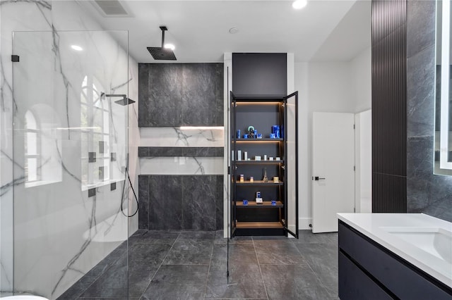 10849 Emerald Chase Dr, Orlando, FL 32836 - bathroom with a marble finish shower, tile walls, vanity, and a tub with marble appearance