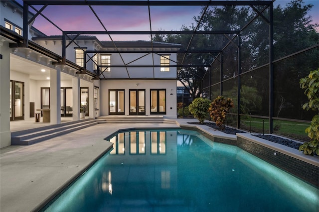 10849 Emerald Chase Dr, Orlando, FL 32836 - pool at dusk with an outdoor pool, a patio area, and a lanai