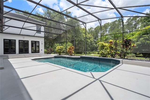 10849 Emerald Chase Dr, Orlando, FL 32836 - outdoor pool with french doors, a patio area, and glass enclosure