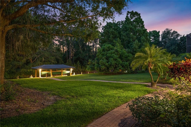 10849 Emerald Chase Dr, Orlando, FL 32836 - yard at dusk featuring a yard and a gazebo