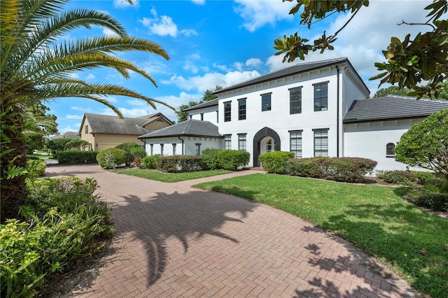 10849 Emerald Chase Dr, Orlando, FL 32836 - view of front of property with a front lawn, stucco siding, and decorative driveway