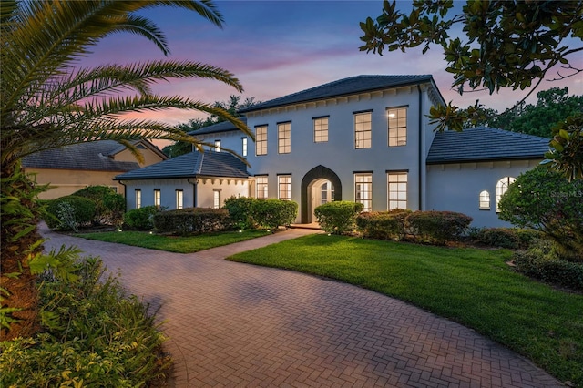 10849 Emerald Chase Dr, Orlando, FL 32836 - view of front of property with stucco siding and a front lawn