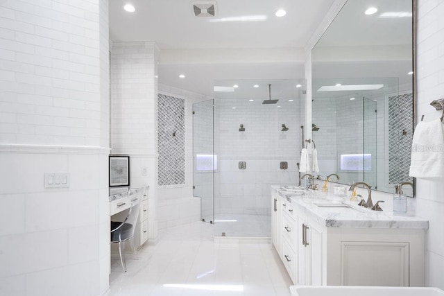 570 Manor Rd, Maitland, FL 32751 - full bathroom featuring double vanity, tile walls, a stall shower, and a sink