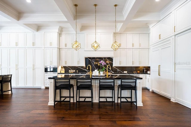 570 Manor Rd, Maitland, FL 32751 - kitchen featuring dark countertops, beam ceiling, and a breakfast bar