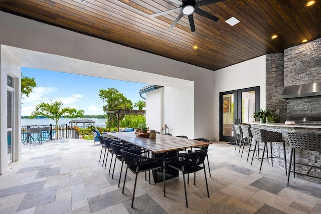 570 Manor Rd, Maitland, FL 32751 - view of patio featuring a pergola, a bar, a ceiling fan, outdoor dining area, and fence