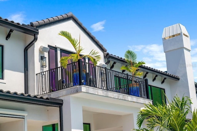 570 Manor Rd, Maitland, FL 32751 - view of home's exterior with a balcony and stucco siding