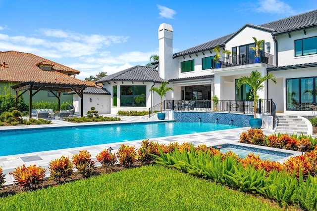 570 Manor Rd, Maitland, FL 32751 - back of property featuring a tiled roof, a chimney, a patio area, a balcony, and an outdoor pool