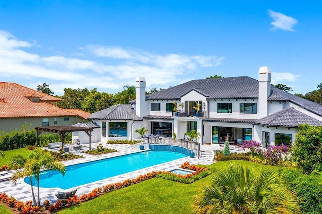 570 Manor Rd, Maitland, FL 32751 - pool featuring a pergola, an outdoor kitchen, and a patio