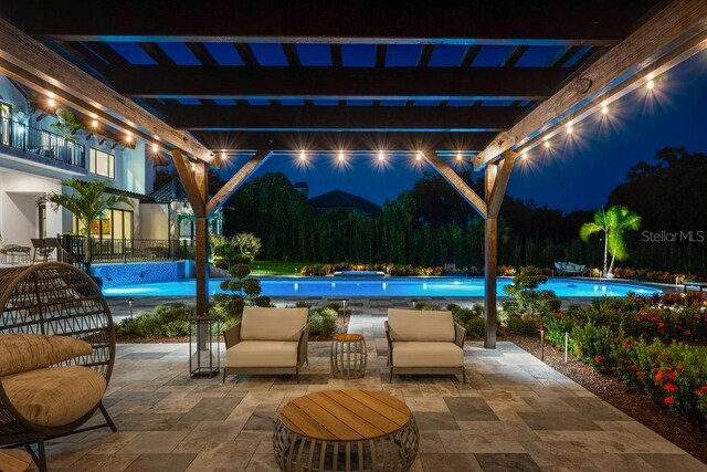 570 Manor Rd, Maitland, FL 32751 - patio at twilight featuring a pergola and an outdoor pool