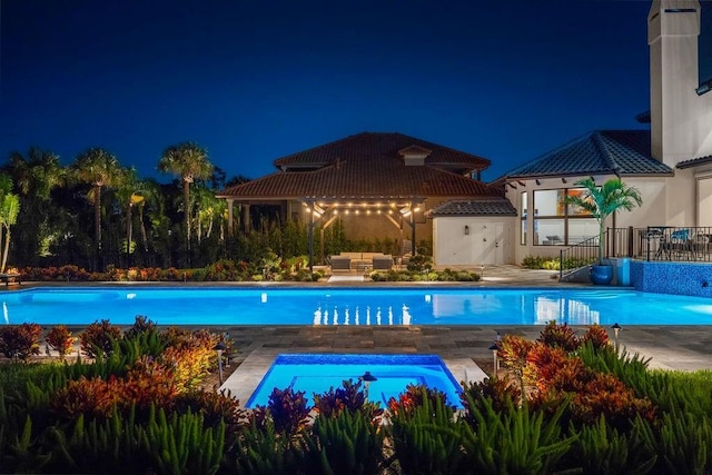 570 Manor Rd, Maitland, FL 32751 - pool at twilight with a gazebo, an outdoor pool, a patio, and outdoor lounge area