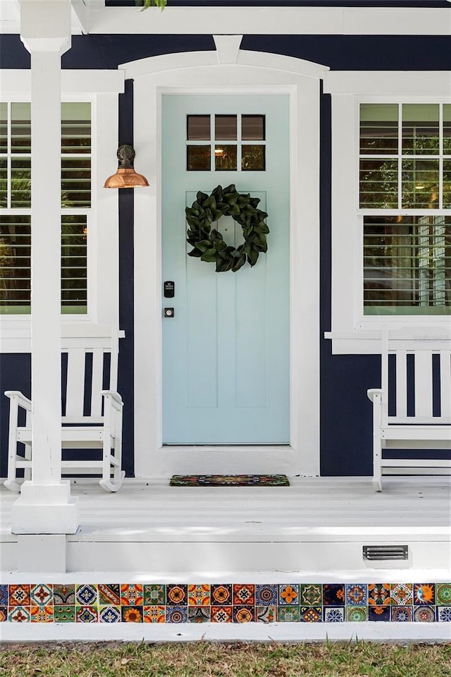 doorway to property with a porch