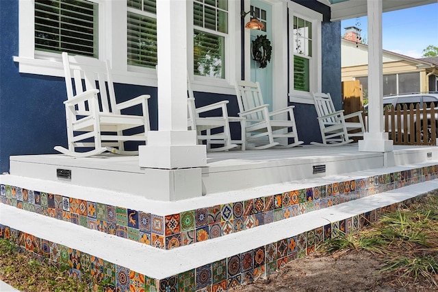 wooden terrace with a porch