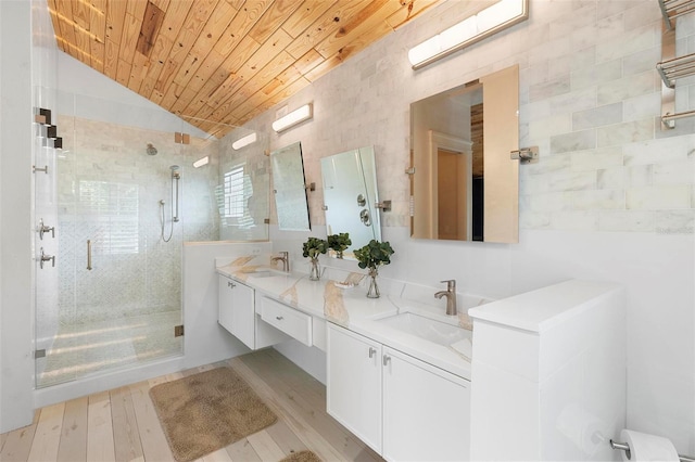 full bath featuring a shower stall, wood ceiling, vaulted ceiling, wood finished floors, and double vanity