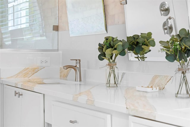 bathroom featuring healthy amount of natural light and a sink