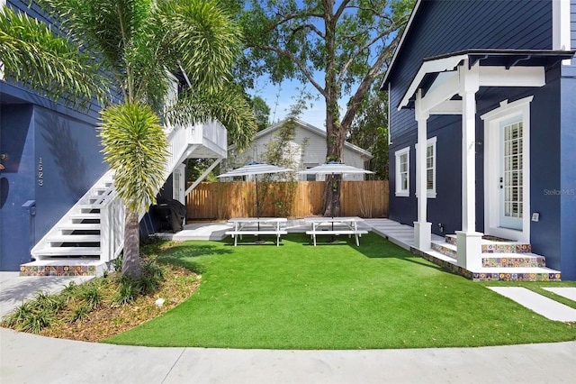 view of yard featuring stairs