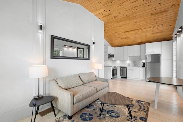 living room with wooden ceiling, lofted ceiling, and light wood-type flooring