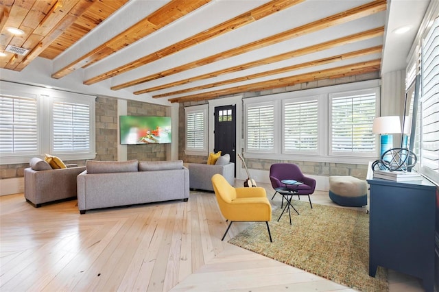 living room with beam ceiling
