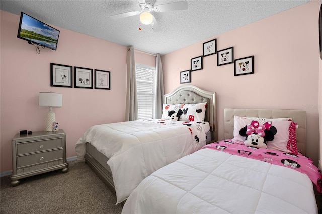 bedroom with carpet floors, a ceiling fan, and a textured ceiling