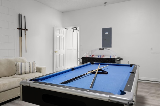 recreation room with baseboards, pool table, wood finished floors, and electric panel