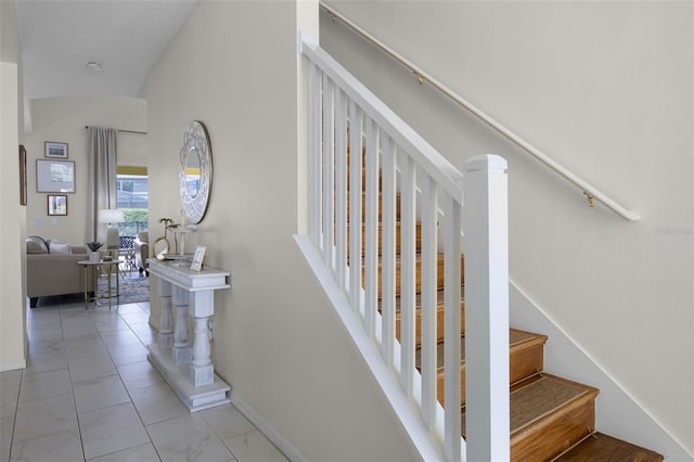 stairs featuring baseboards