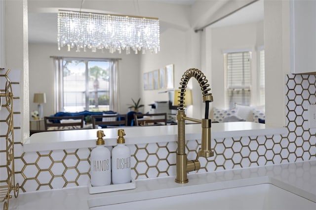 details featuring a sink and tasteful backsplash