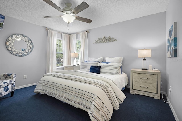 carpeted bedroom with baseboards, ceiling fan, and a textured ceiling