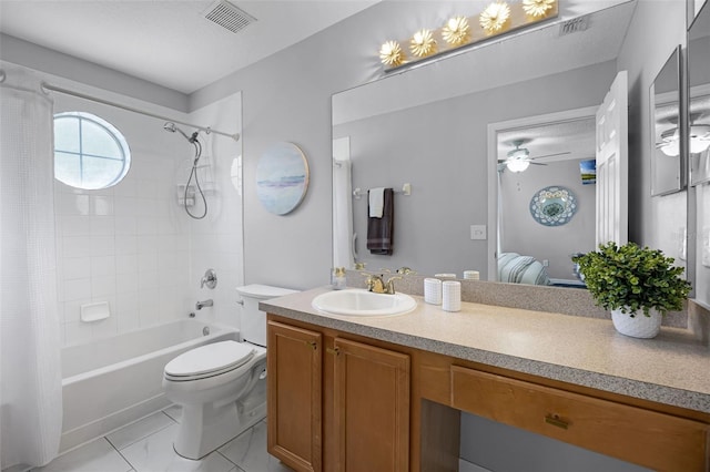 ensuite bathroom with visible vents, vanity, toilet, ceiling fan, and shower / bath combo