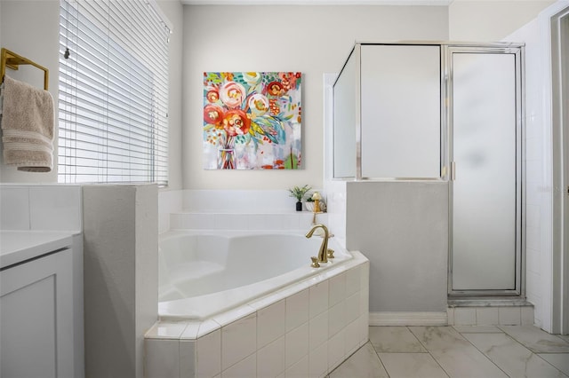 bathroom featuring a shower stall and a bath