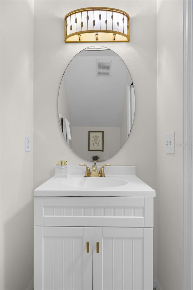 bathroom with visible vents and vanity