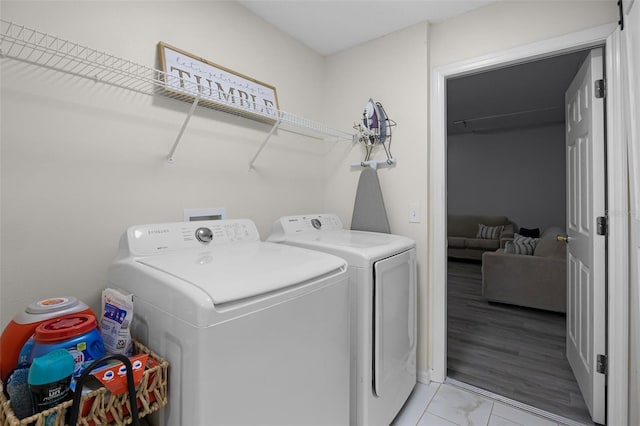 laundry room with laundry area and washer and clothes dryer
