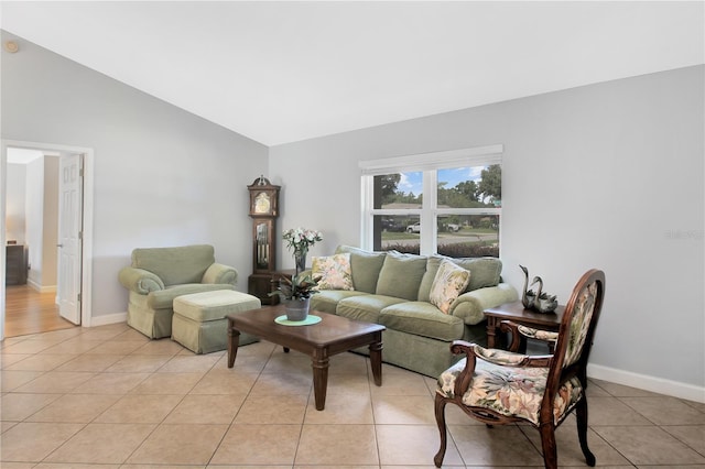 4833 Palm Tree Ct, Windermere, FL 34786 - living area with lofted ceiling, light tile patterned floors, and baseboards