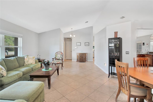 4833 Palm Tree Ct, Windermere, FL 34786 - living area featuring light tile patterned floors, a chandelier, baseboards, and high vaulted ceiling