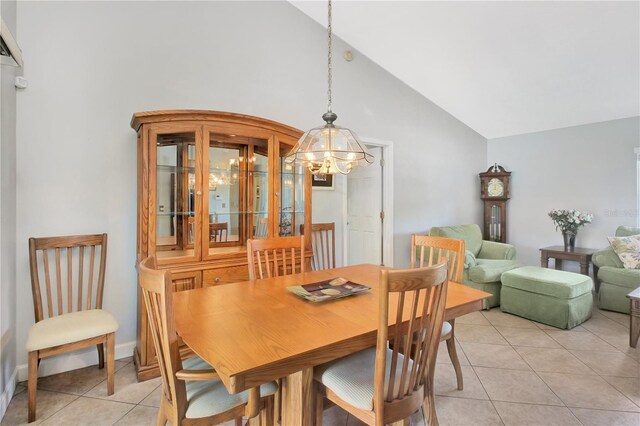 4833 Palm Tree Ct, Windermere, FL 34786 - dining room featuring light tile patterned flooring, a chandelier, and high vaulted ceiling