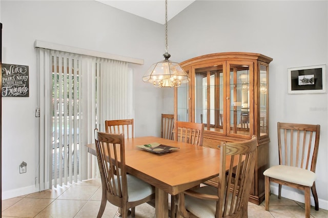 4833 Palm Tree Ct, Windermere, FL 34786 - dining area with a chandelier, baseboards, light tile patterned floors, and a high ceiling