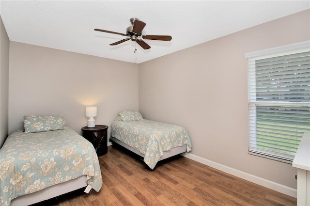 4833 Palm Tree Ct, Windermere, FL 34786 - bedroom featuring wood finished floors, baseboards, and a ceiling fan