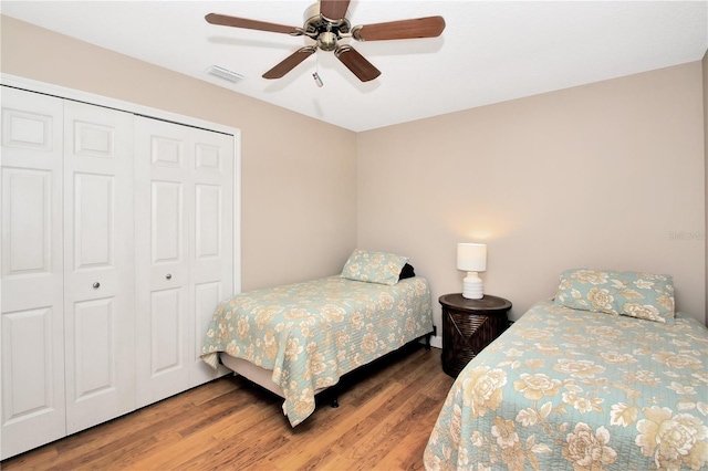 4833 Palm Tree Ct, Windermere, FL 34786 - bedroom featuring a closet, wood finished floors, and ceiling fan