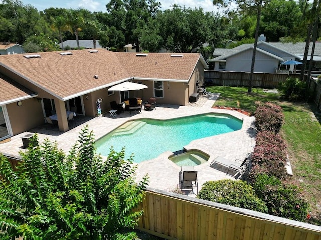 4833 Palm Tree Ct, Windermere, FL 34786 - view of swimming pool featuring a fenced backyard, a patio, an outdoor hangout area, and a pool with connected hot tub