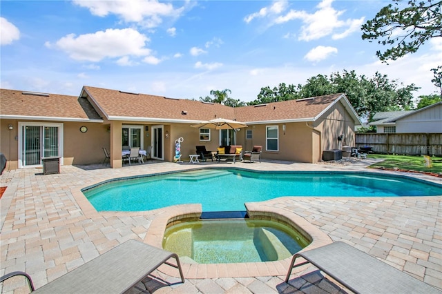 4833 Palm Tree Ct, Windermere, FL 34786 - view of swimming pool featuring a patio area and a pool with connected hot tub