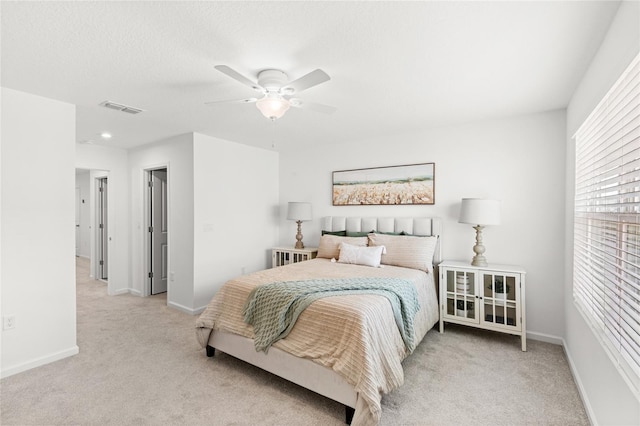 bedroom featuring visible vents, baseboards, a ceiling fan, and carpet floors