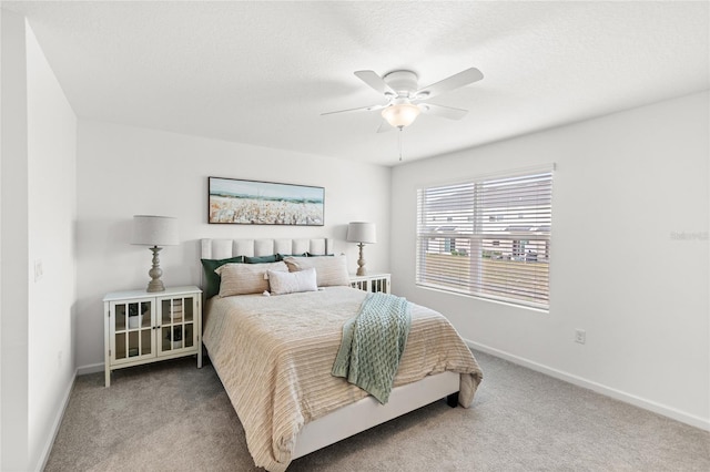 bedroom featuring baseboards, a ceiling fan, and carpet floors