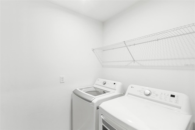 laundry area featuring laundry area and washing machine and clothes dryer