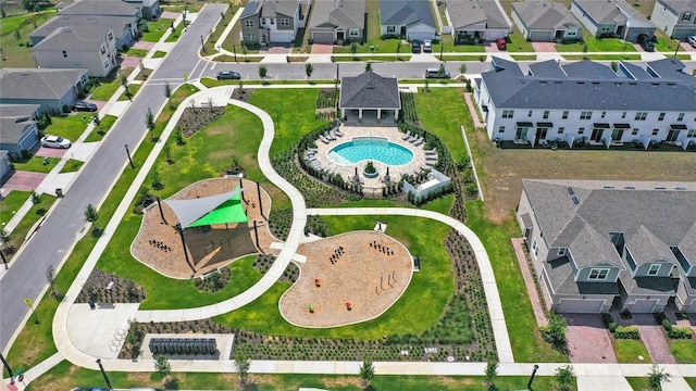 birds eye view of property with a residential view