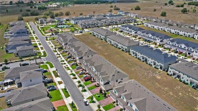 birds eye view of property with a residential view