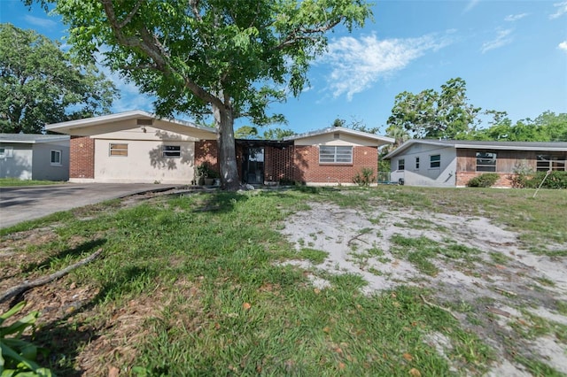 1136 Lakewood Park Dr, Daytona Beach, FL 32117 - single story home with a front yard and brick siding