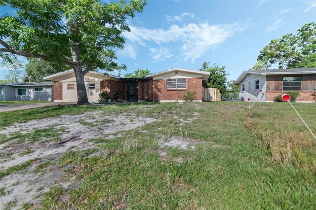 1136 Lakewood Park Dr, Daytona Beach, FL 32117 - view of front of home featuring brick siding